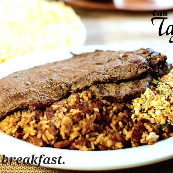 Tajadas breakfast with steak and rice