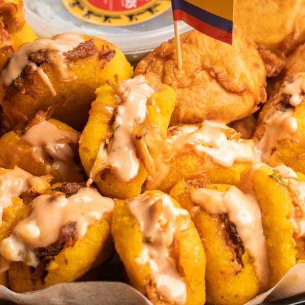 Colombian aborrajado platter with sauce
