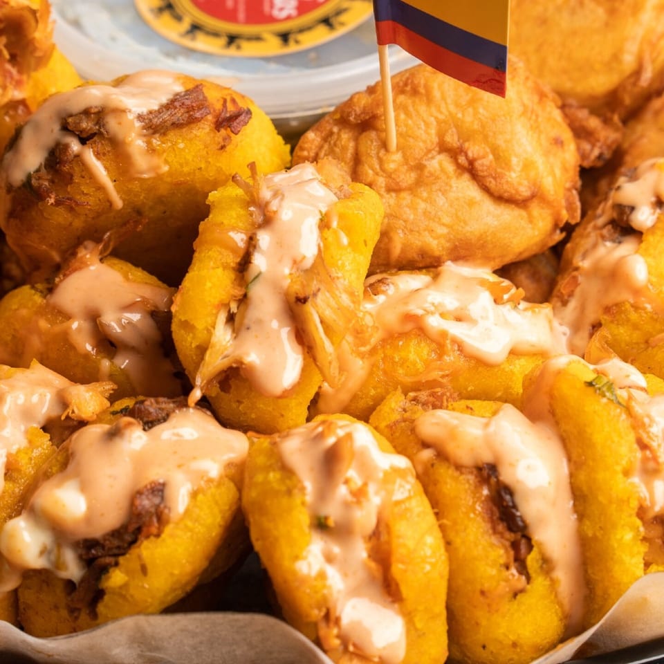 Colombian aborrajado platter with sauce